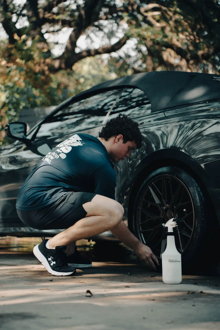 Cleaning a wheel and tire with a spray cleaner